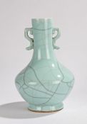Chinese celadon glaze porcelain vase, the long neck with arched handles and squat body on a circular
