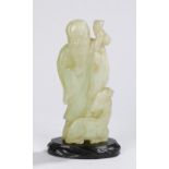 Chinese jade carving, Qing dynasty, of large proportions, of a bearded scholar above a reclining