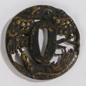 Japanese tsuba, with a part gilt highlighted eagle and trees, 6cm diameter