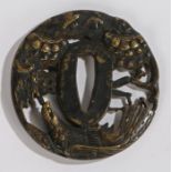 Japanese tsuba, with a part gilt highlighted eagle and trees, 6cm diameter