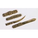 Japanese brass objects, to include two folding knives and two small letter openers, (4)