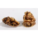 Two Japanese ivory netsuke, Meiji period, the first with a shell and figures crawling about it,