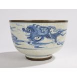 Chinese porcelain bowl, Qing Dynasty, with a dragons in clouds glazed in blue and a crackle
