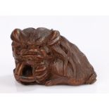 Japanese carved wood netsuke, of shishi holding a pierced ball, signed Masayuki, 4cm longOverall