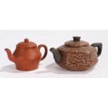 Two Chinese teapots, the first Yixing type of small proportions, with a circular body, impressed