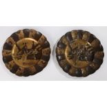 Pair of Japanese metal alloy dishes, with a samurai and lady playing a flute to each dish, 24cm