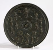 Japanese Meiji period bronze mirror, with a figural and object design to include immortals and