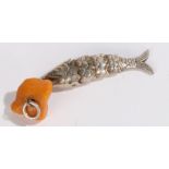 Chinese articulated white metal fish, with an amber section to the tip, 65mm long