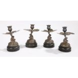 Set of four silver Vietnamese candlesticks, the sconce above a leaf and dragon, 19cm high, (4)