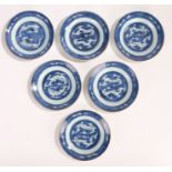 Set of six Chinese porcelain plates, Kangxi, with blue and white dual dragon decoration with cloud