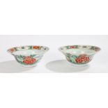 Pair of Chinese famille verte porcelain bowls, Kangxi, with flared lips decorated with flowers and