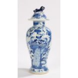 Chinese porcelain vase and cover, Qing Dynasty, decorated with blue and white with resting peacocks,