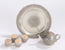 Vietnamese white metal tea set, to include a tea pot of small proportions, four tea bowls and a