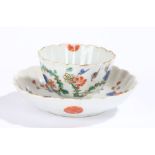 Chinese porcelain famille verte tea bowl and saucer, Kangxi, with a branch and projecting flowers,