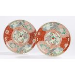 Pair of Japanese Meiji period porcelain plates, the centre of each with two birds and flowers within