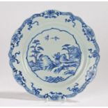 Chinese porcelain plate, Qing Dynasty, with a central figure walking amongst animals with a pagoda