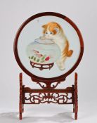 Chinese carved hardwood table screen, the circular central panel with depiction of a kitten