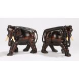 Pair of Chinese carved elephants, early 20th Century, in standing position, 16cm long, (2)