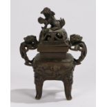 Chinese bronze censor, Qing dynasty, with a dog of foo above a scroll top flanked by arched masks