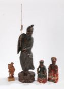 Collection of Chinese carved figures, to include a standing figure, 61cm high, another standing