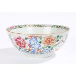 Chinese porcelain famille rose bowl, Qing Dynasty, decorated with flowers to a green base, 24cm