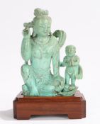 Chinese turquoise figural carving, depicting a crouched female figure and a boy with his hands