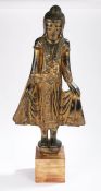 Thailand carved buddha, standing position with arms slightly raised standing on a plinth base with