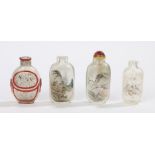 Four Chinese reverse painted glass snuff bottles, the first with a red raised panel edge with an