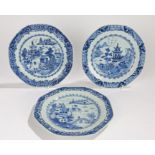 Three Chinese porcelain Export ware plates, each with a pagoda and river scene in blue and white,