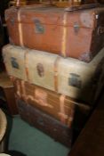 Four early 20th Century travel trunks, of varying sizes, the largest 94cm wide (4)