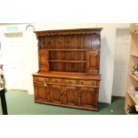 18th Century style oak dresser and rack, the plate rack above the dresser base with frieze drawers