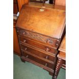 Oak bureau, the fall opening to reveal an interior with pigeon holes and small drawers, above four