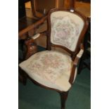 French style fauteuil, with foliate carved cresting rail, over-stuffed back, seat and arms, on