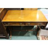 Regency style sofa table, with two frieze drawers above pierced supports, joined by a single