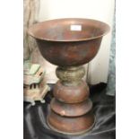 Copper lamp, the bowl form top section above a cast brass stem and stepped copper base, 24.5cm