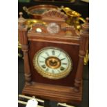 Ansonia Troy mantel clock, with shell carved pediment, the ivorine dial with Roman numerals, 27cm