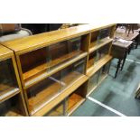 Pair of 20th Century Globe Wernicke style mahogany bookcases, the three-tier sections with glass