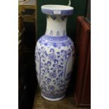 20th Century Chinese vase, the blue and white body decorated with foliage, 62cm high