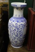 20th Century Chinese vase, the blue and white body decorated with foliage, 62cm high