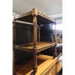 Mid 20th Century oak drinks trolley, both tiers with carved decorations, raised on turned legs, on