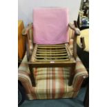 Arm chair upholstered in a striped material, together with a Parker Knoll armchair, with sweeping