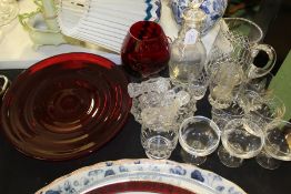 Glassware, to include ruby circular dish, ruby balloon glass, water jug, knife rests etc. (qty