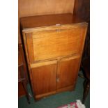 Basil Sharland oak bureau cabinet, produced in the 1930s, the fall opening to reveal shelves of