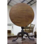 George III mahogany occasional table, the tilt top raised on a turned column and cabriole legs,