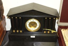 Edwardian slate mantel clock, of architectural form, with triangular pediment, the white dial with