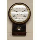 Comitti of London mahogany wall clock, the white dial with Roman numerals, the case with visible