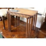Mid Century nest of three tables, the largest table with a geometric inlay, 55cm wide (3)