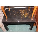 Oriental ebonised occasional table, the black lacquer rectangular top decorated with foliage, 49cm x