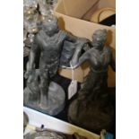 Pair of classical cast metal figures, depicting a man with his hand on a tree stump and a lady