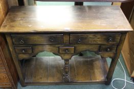18th Century style small oak dresser base, with two frieze drawers above three smaller drawers,